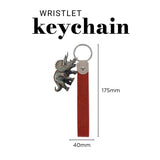 The Lord Is My Strength Faux Leather and Metal Wristlet Keychain with Dinosaur Charm